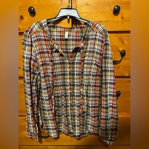 Pilcro size L button up top with tie.